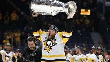 Penguins forward Phil Kessel raises the Stanley Cup after Pittsburgh beat Nashville in Game 6 of the Cup Final. (Photo courtesy of the Pittsburgh Penguins via Twitter)