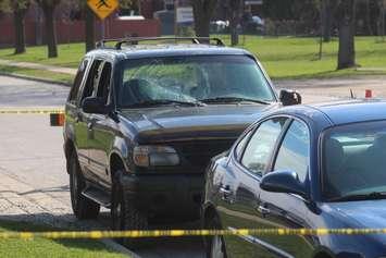 An SUV with visible damage to its windshield and at least two windows out is shown on Shepherd Street East and Lillian in Windsor, April 22, 2019. Photo by Mark Brown/Blackburn News.