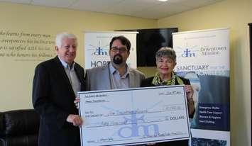 A $50,000 donation to the Downtown Mission, October 19, 2017. (Photo by Maureen Revait)