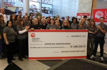 Chrysler employees present a cheque to the United Way of Windsor-Essex, December 5, 2014. (photo by Mike Vlasveld)