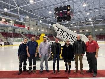 Anthony Grossi of Grossi Construction, centre, and Leamington Mayor Hilda MacDonald, third from right, help unveil the new electric Zamboni at Nature Fresh Farms Recreation Centre, January 20, 2023. Photo courtesy Municipality of Leamington.