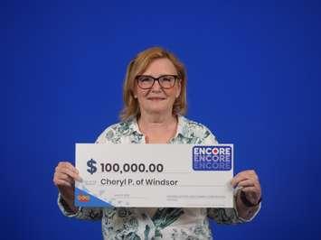 Cheryl Parent of Windsor shows off her $100,000 cheque at the OLG Prize Centre in Toronto, June 15, 2022. Photo courtesy Ontario Lottery and Gaming.