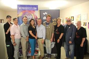 Mary Riley of Caesars Windsor, fourth from left, and David Lenz of Windsor-Essex PrideFest, centre, join representatives from both on June 5, 2019. Photo by Mark Brown/Blackburn News.