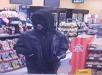 Suspect wanted in the robbery of a convenience store in West Windsor on February 18, 2018, taken from surveillance footage. Photo courtesy Windsor Police Service.