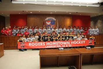 The LaSalle Vipers, in grey sweaters, join Lasalle Town Council, town administration and youth hockey players in unveiling LaSalle as a Hometown Hockey host, September 10, 2019. Photo by Mark Brown/Blackburn News.