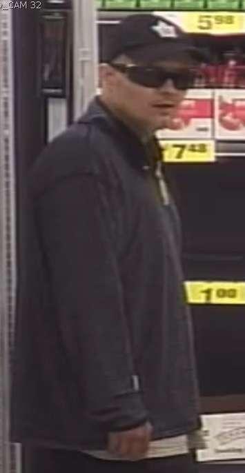 Surveillance camera image of a suspect wanted in connection with a robbery on Dougall Avenue in Windsor on May 21, 2020. Image provided by Windsor Police Service.